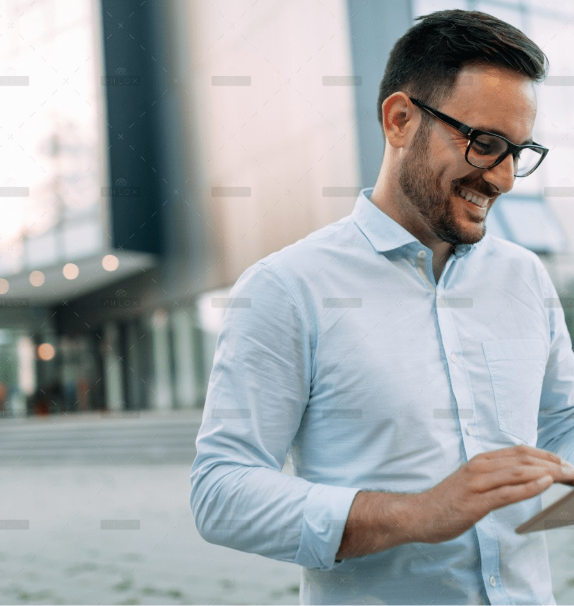 demo-attachment-59-portrait-of-businessman-in-glasses-holding-tablet-AWVHCJU